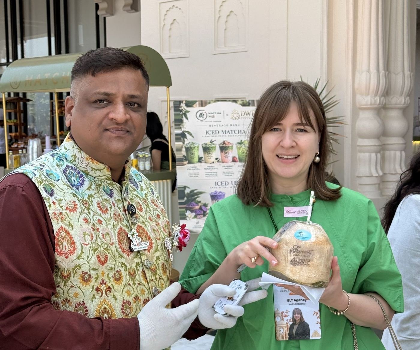 Guest holding a Mr. Coconut personalised coconut with our team