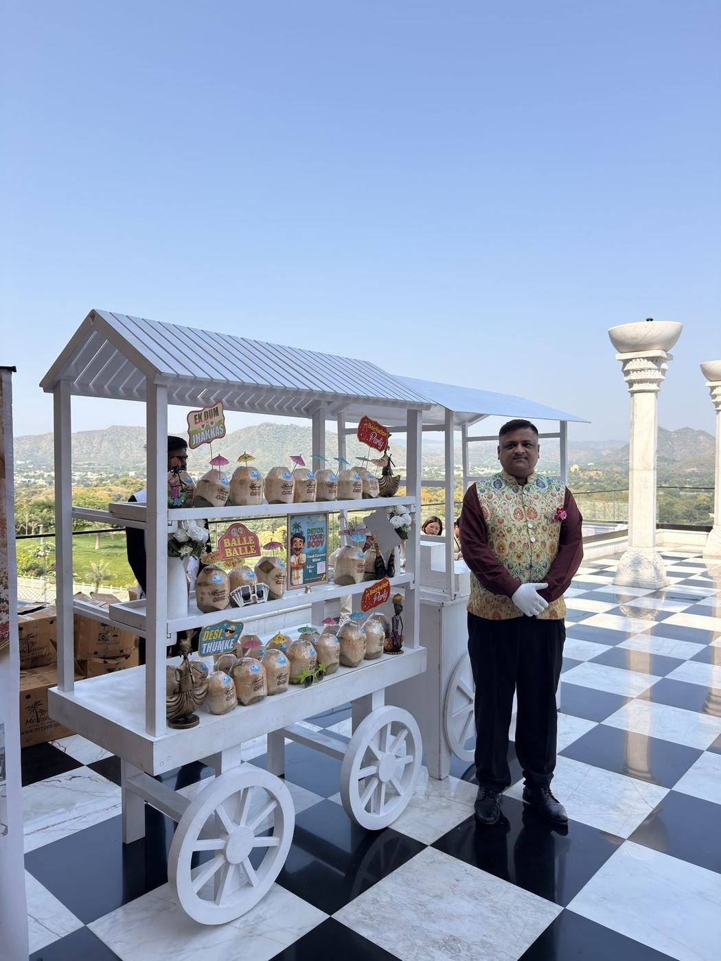 CocoCart with a Mr. Coconut CocoBoy at a hill-view terrace