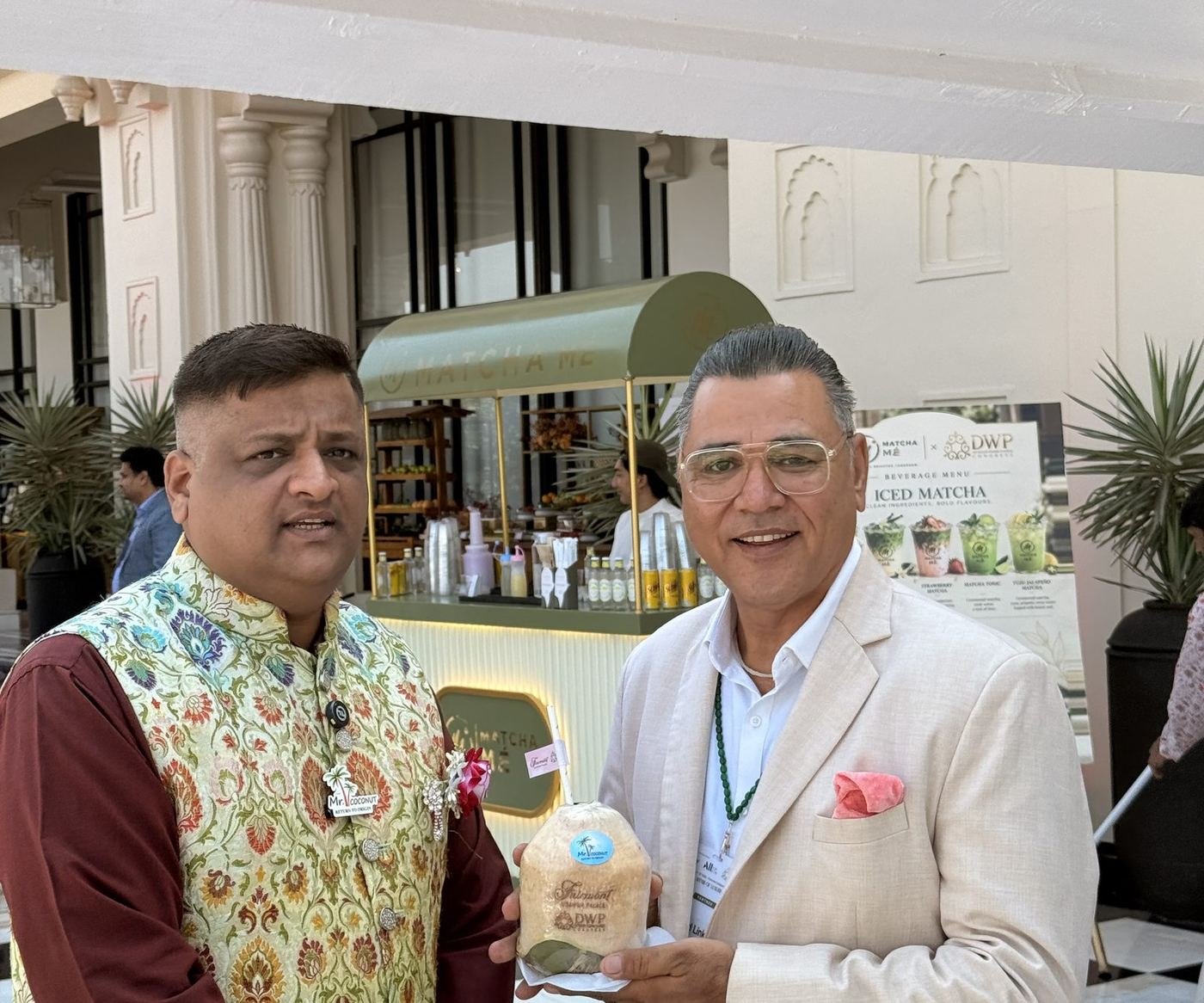 Senior guest enjoying a Mr. Coconut coconut