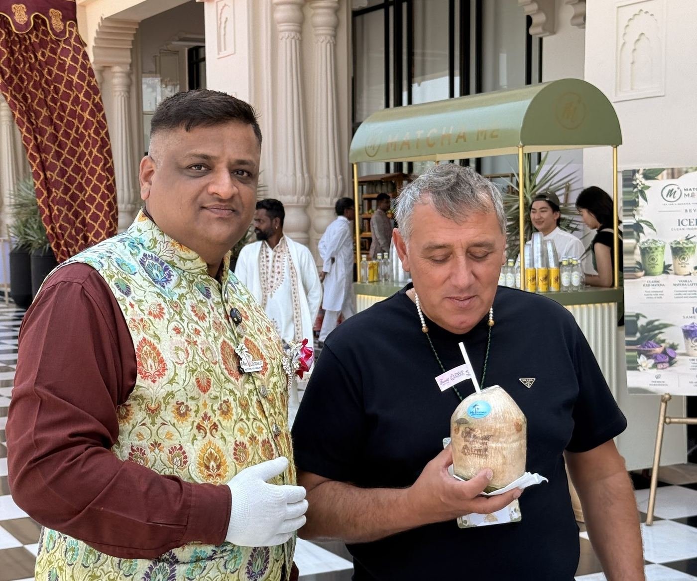 Guest holding an engraved coconut outdoors