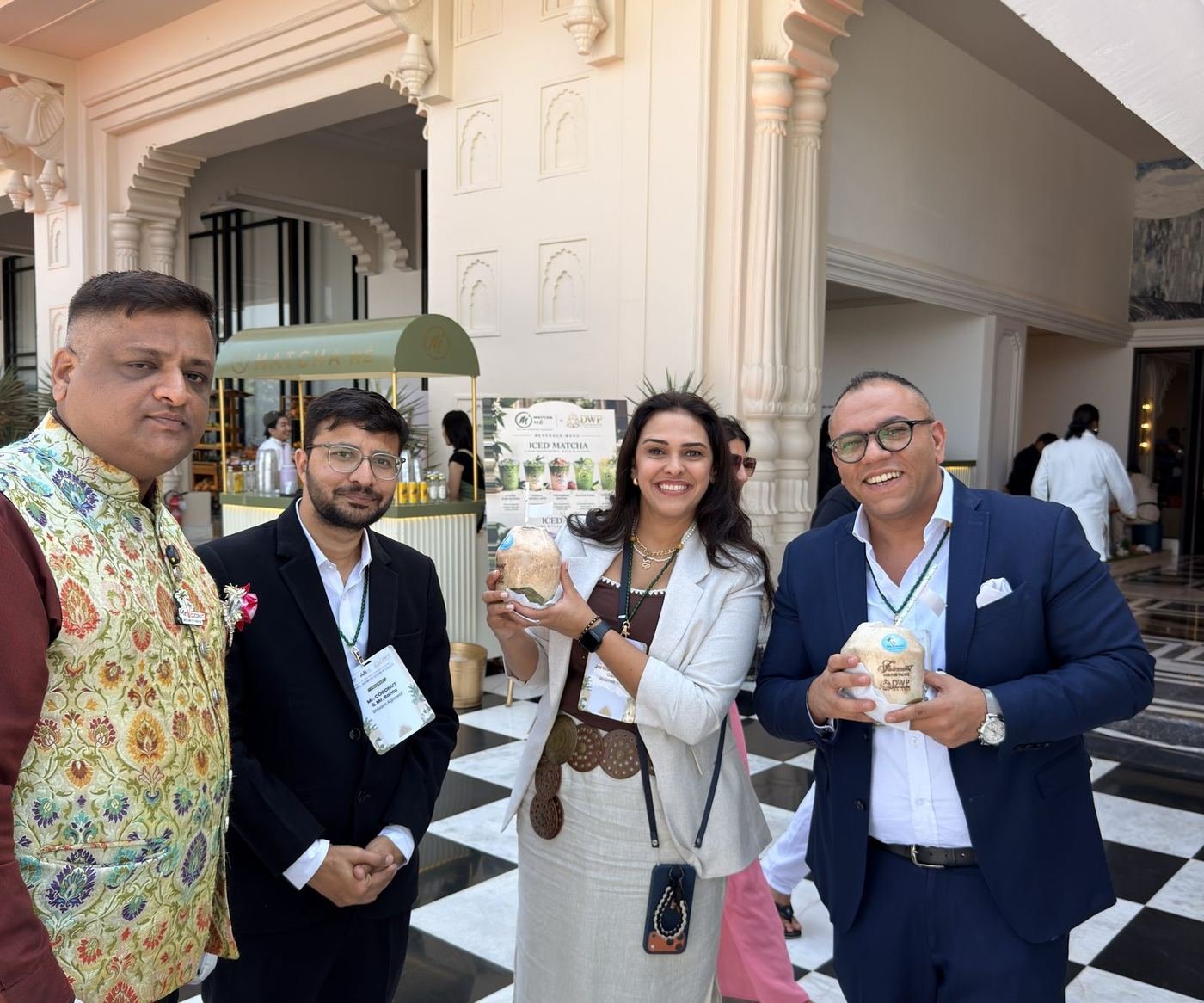 Guests together with coconuts on the event terrace