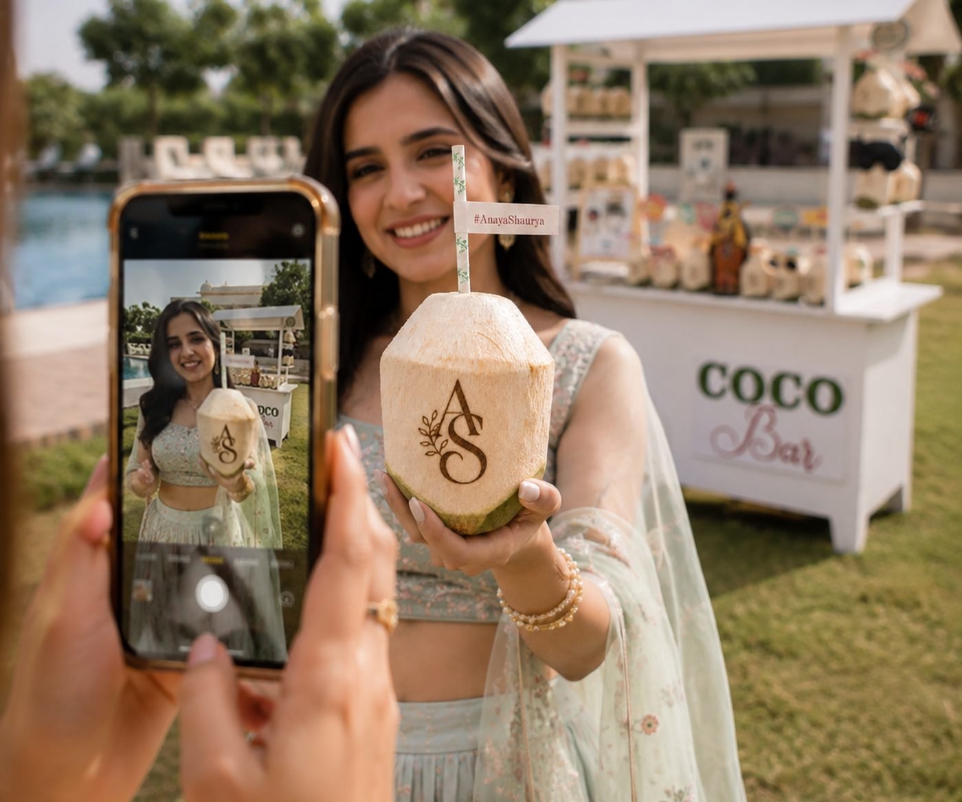 Guest posing with a monogram engraved coconut beside the Mr. Coconut Coco Bar