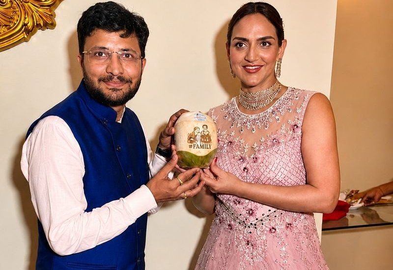 Happy customers holding branded coconuts at an event